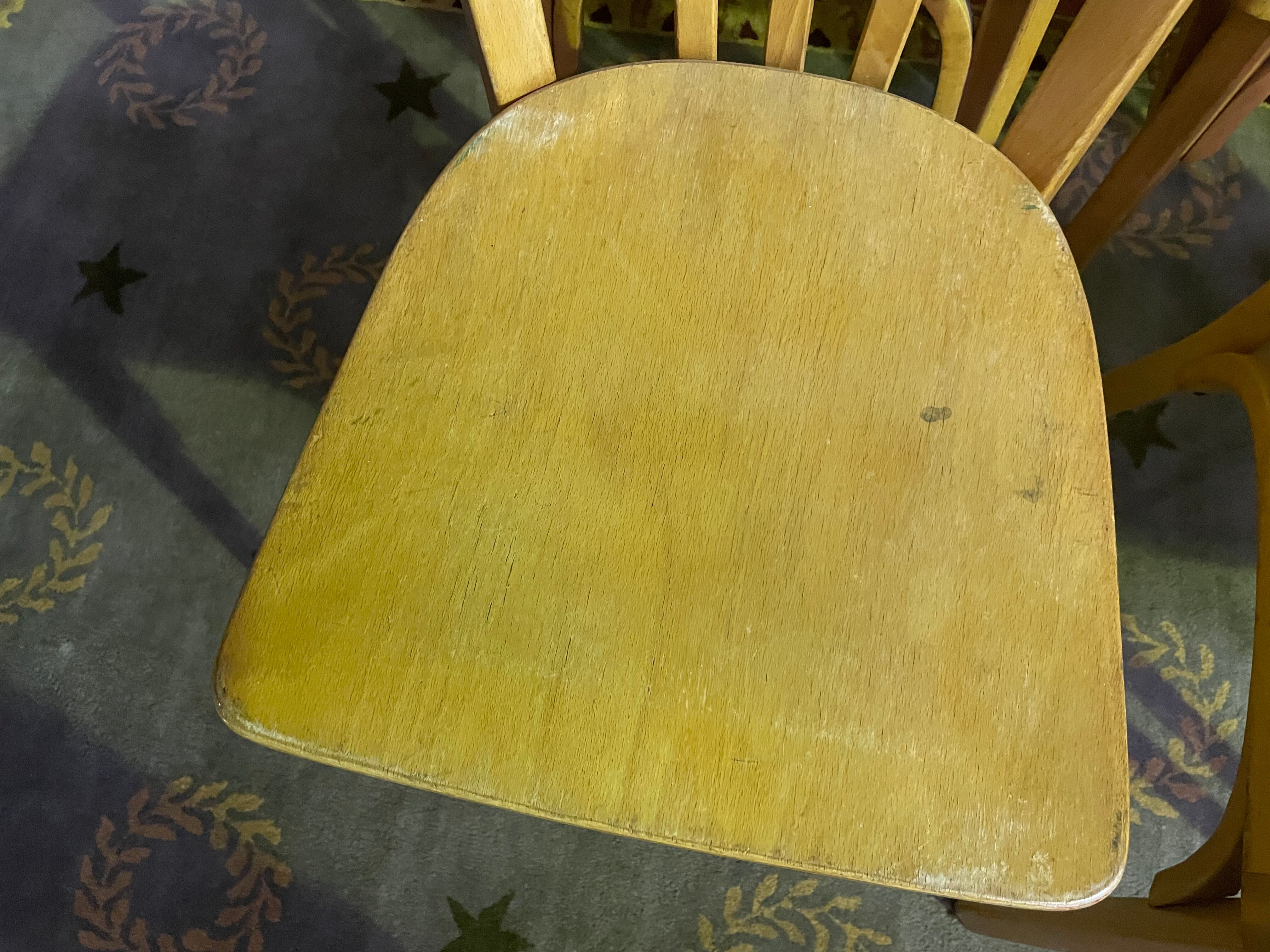 Suite of 6 bistro chairs signed "baumann"