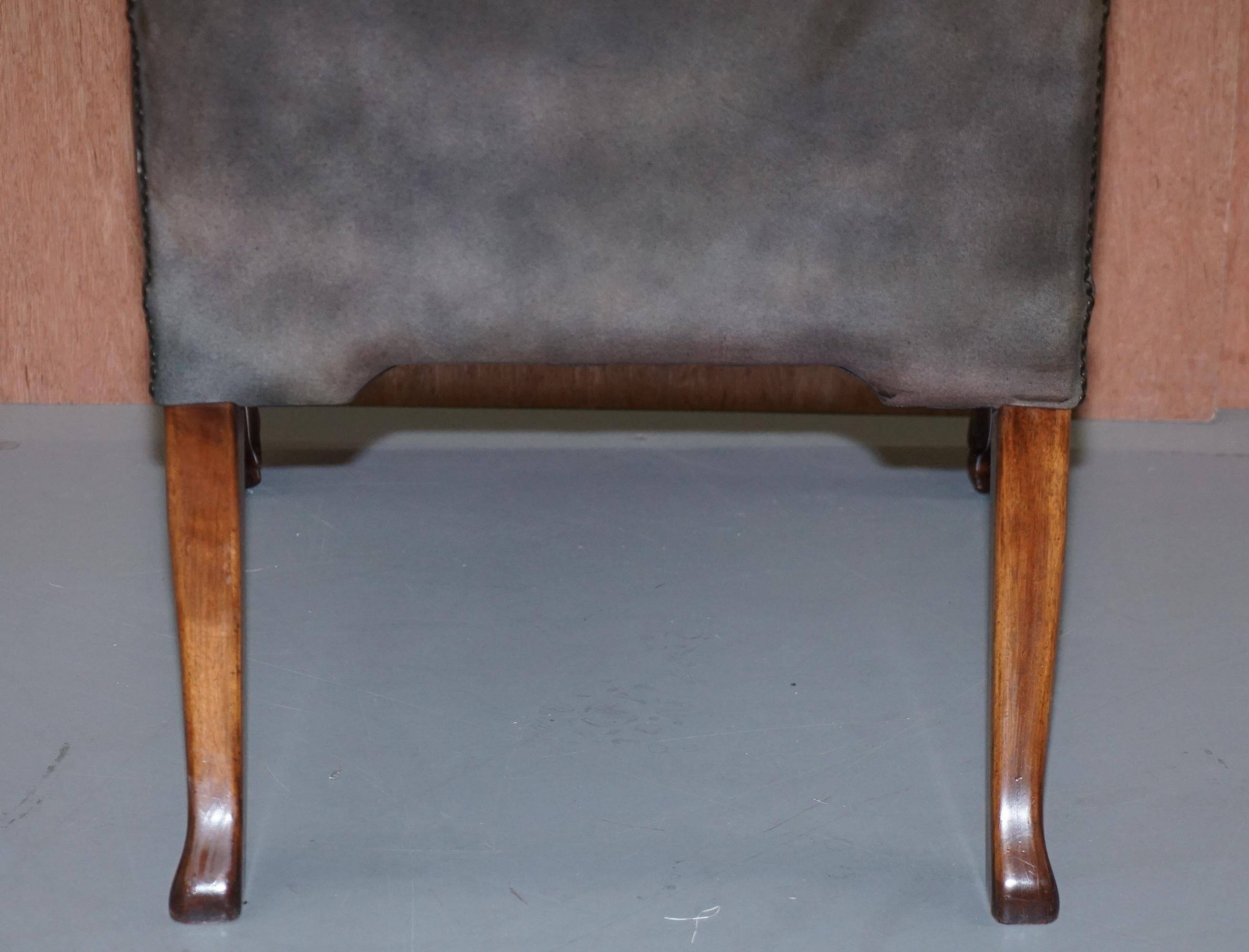 Gainsborough armchair George II leather Chesterfield hand-carved with claw and ball feet.