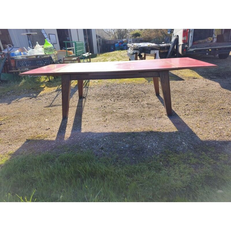 1960s oak dining table with integrated extensions.