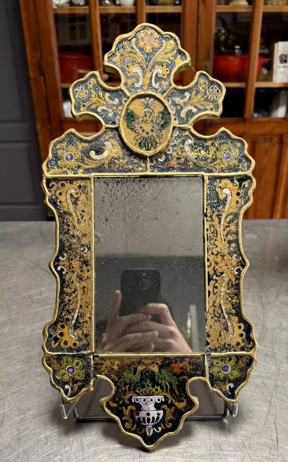 Eglomise glass mirror with scrollwork and branch races decoration
