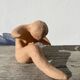 Terracotta sculpture figurine of a woman