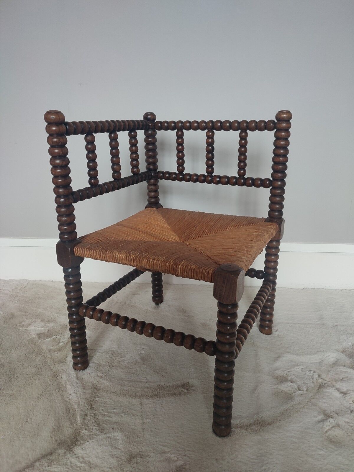 Turned wooden corner chair