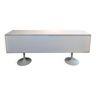A vintage mid century space age sideboard with white sliding doors