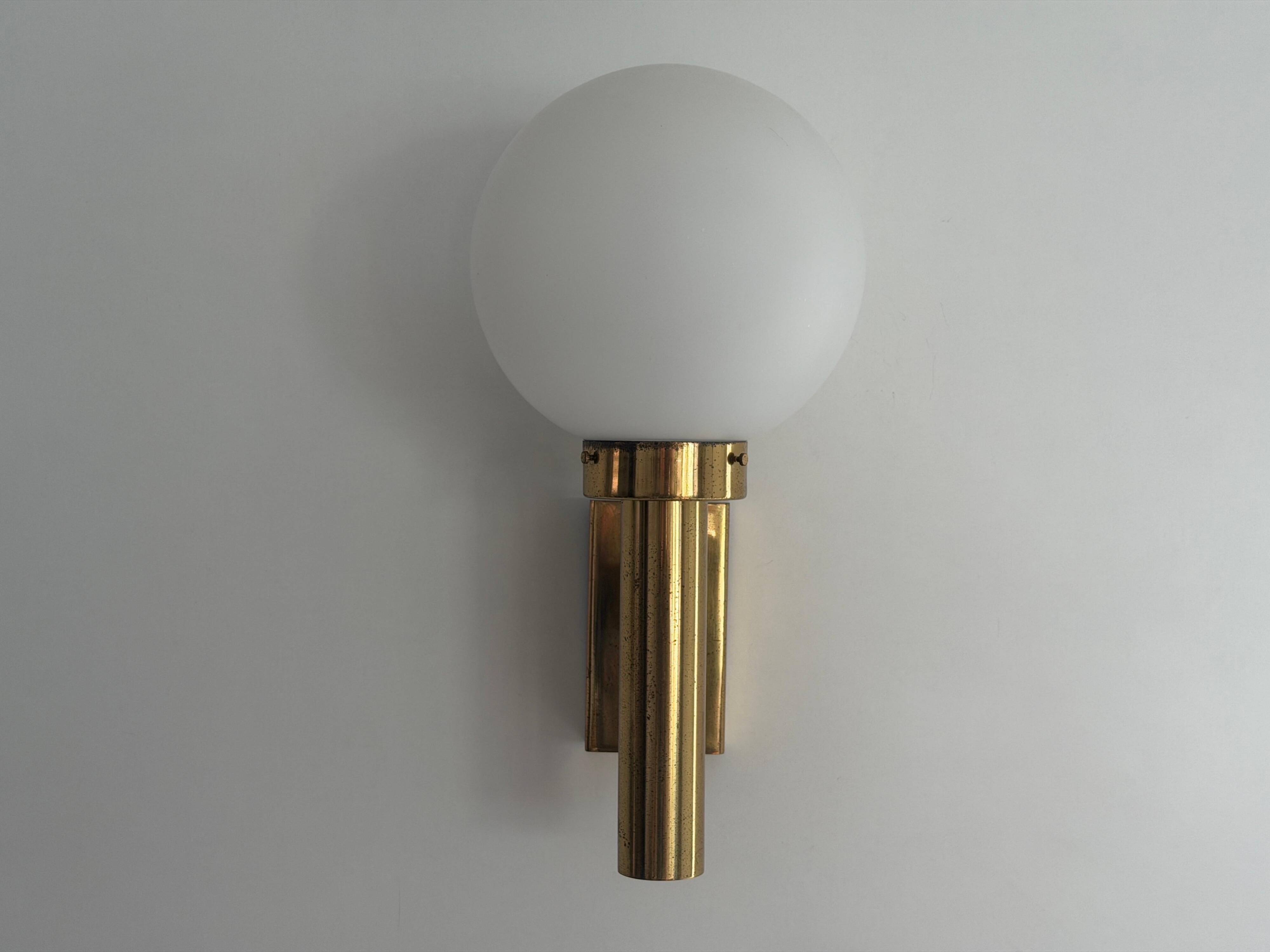Large minimalist cinema wall light in opal glass and heavy brass, 1960s, Germany
