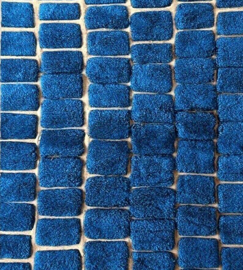 Handmade traditional pure wool carpet with blue patterns.