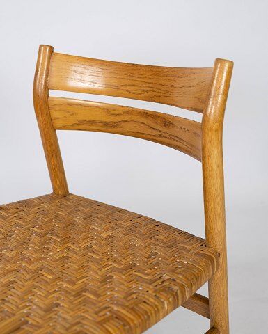 A set of four dining room chairs in oak and seat in papercord, designed by Børge Mogensen