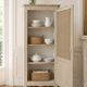 Vintage beige wardrobe made of wood and jute fabric.