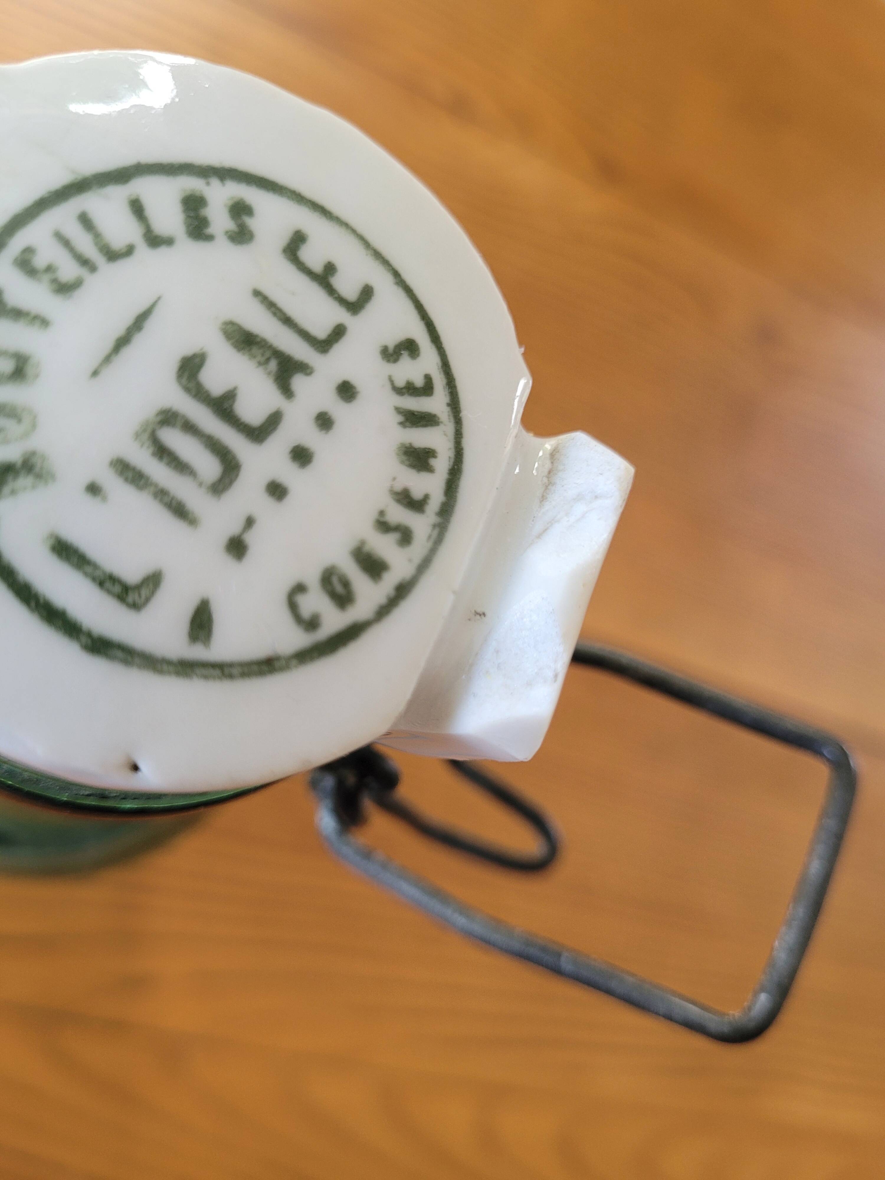 Vintage glass bottle l'Idéale with porcelain stopper