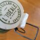 Vintage glass bottle l'Idéale with porcelain stopper