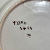 Large earthenware dish signed with bird decoration