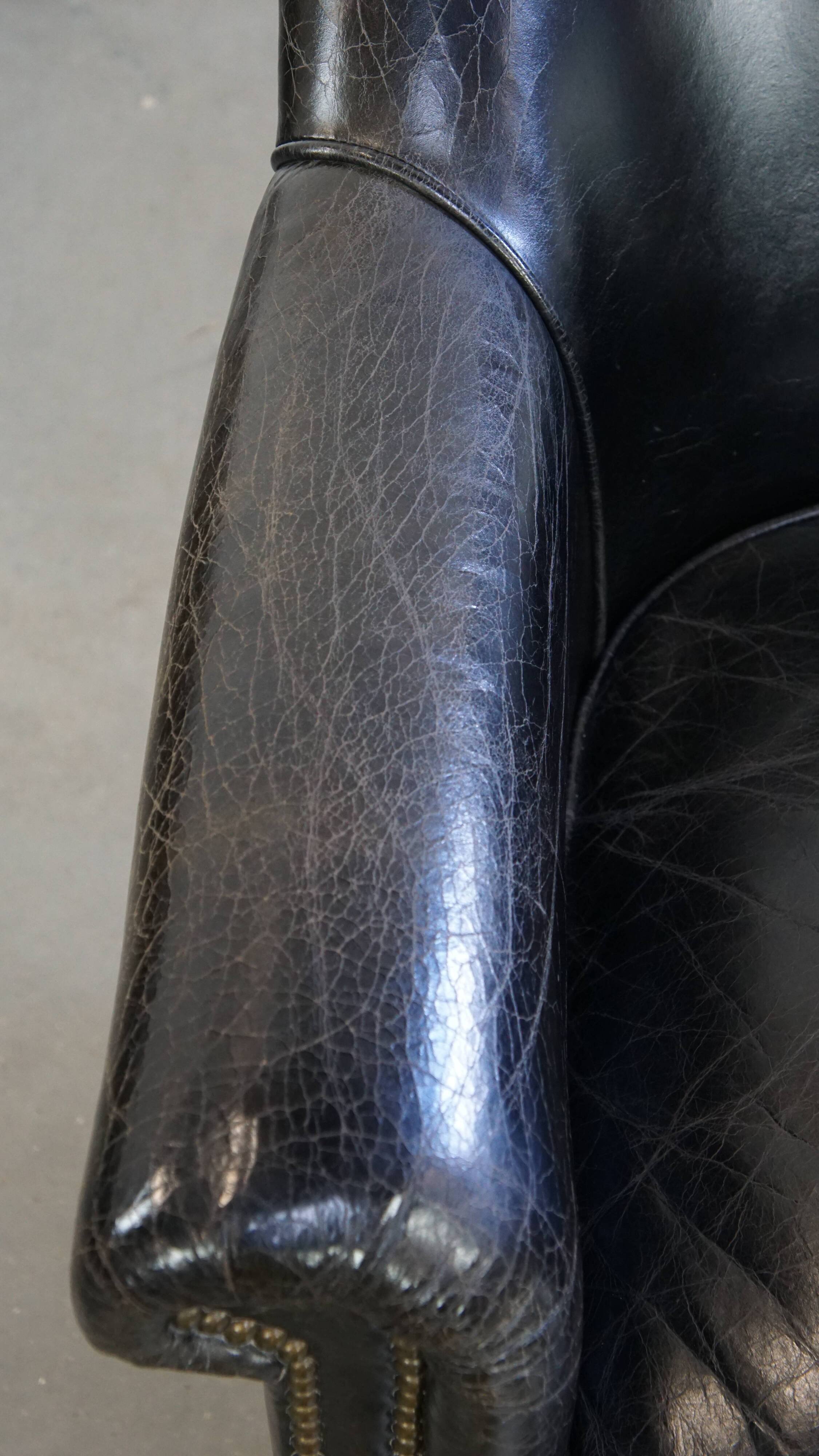 Black grained cowhide leather armchair