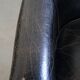 Black grained cowhide leather armchair