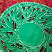 Openwork XL dish in green slurry like olive branches