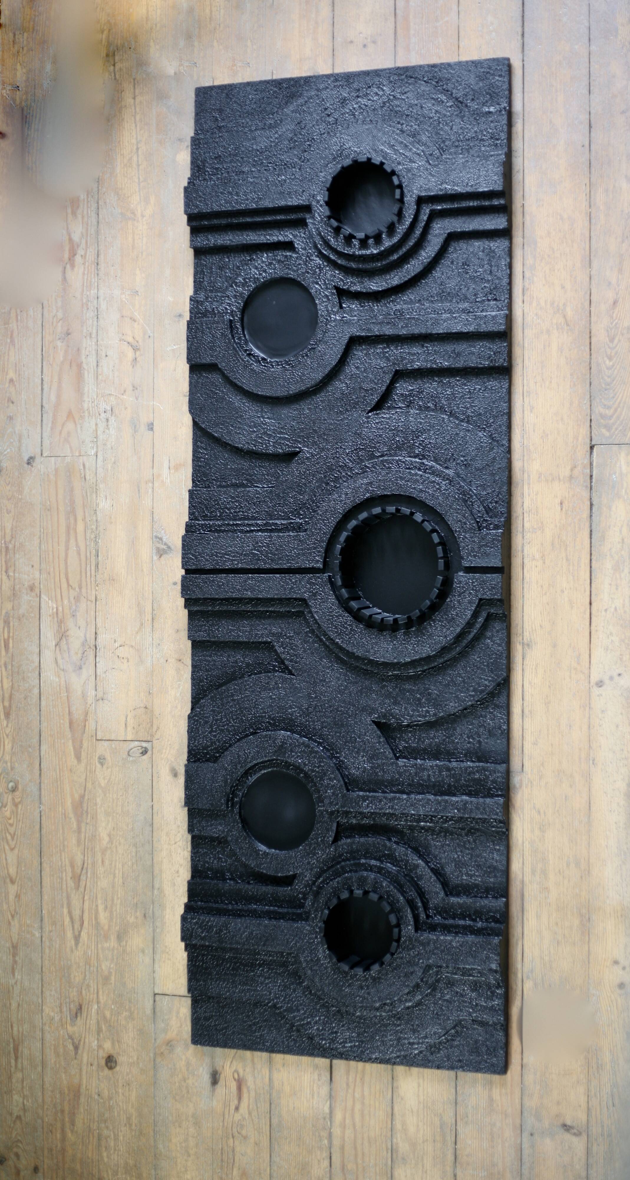 Wall sculpture, wood and black coating, late 1970s