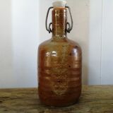 Old bottle of varnished sandstone