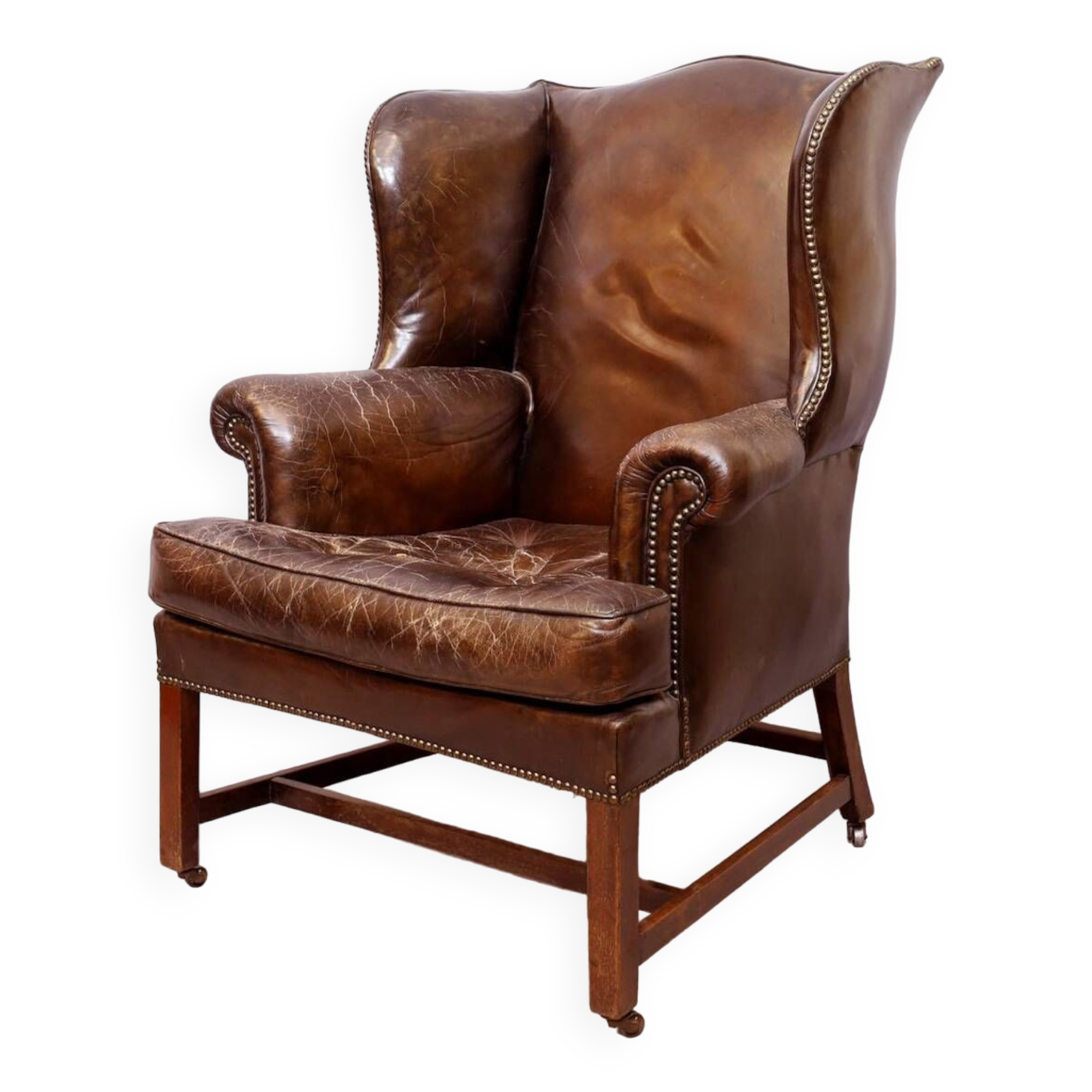 Wingback armchair in dark brown patinated leather, 1970s