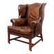 Wingback armchair in dark brown patinated leather, 1970s