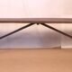 Old bench in Burmese teak with a wrought iron base.