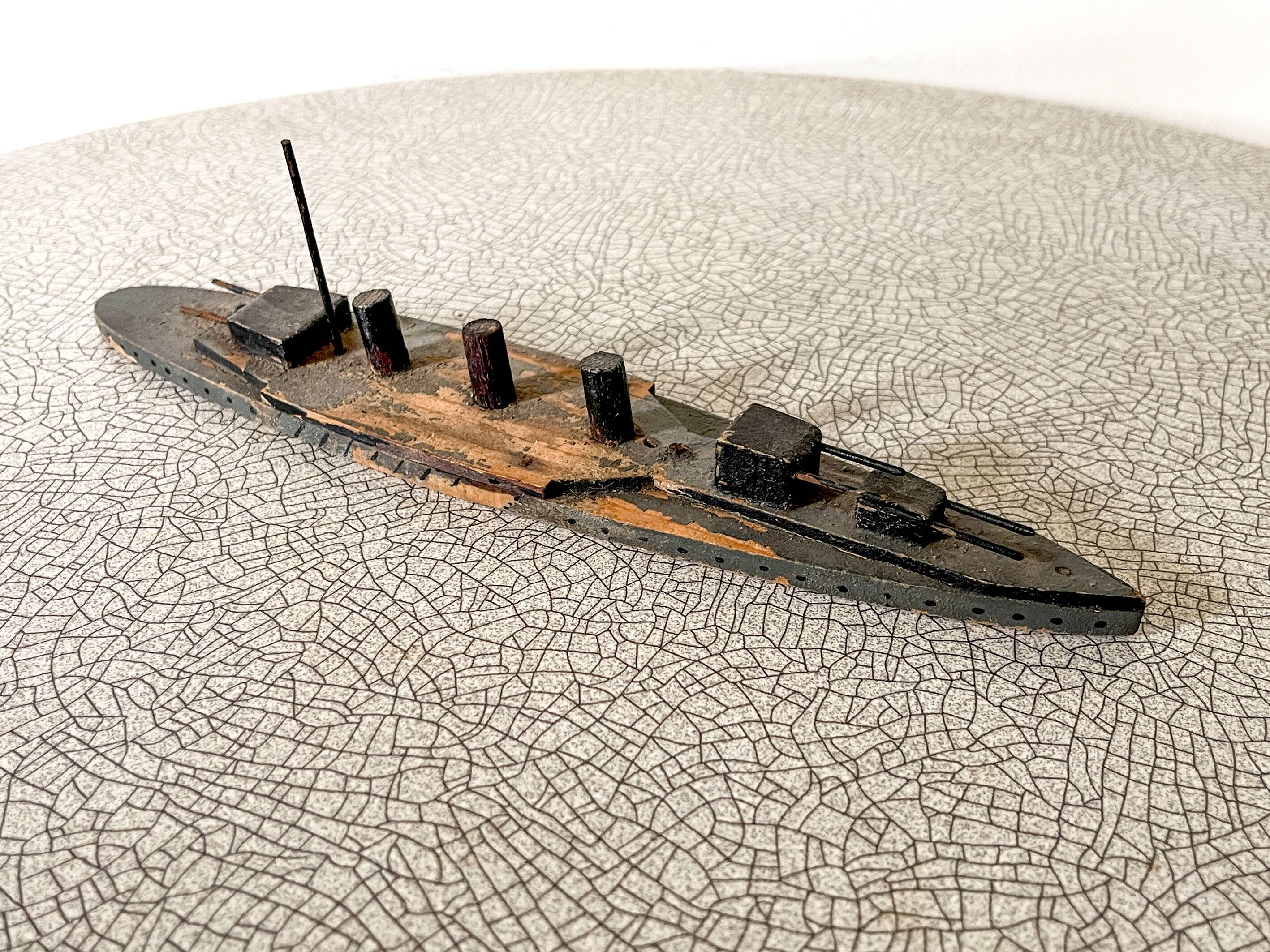 Wooden destroyer boat, antique toy from the early century.