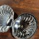 Vintage silver-plated shell butter dish with transparent bowl.