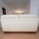 Beige leather sofa with solid wood frame