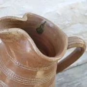 Old stoneware wine jug with patterns