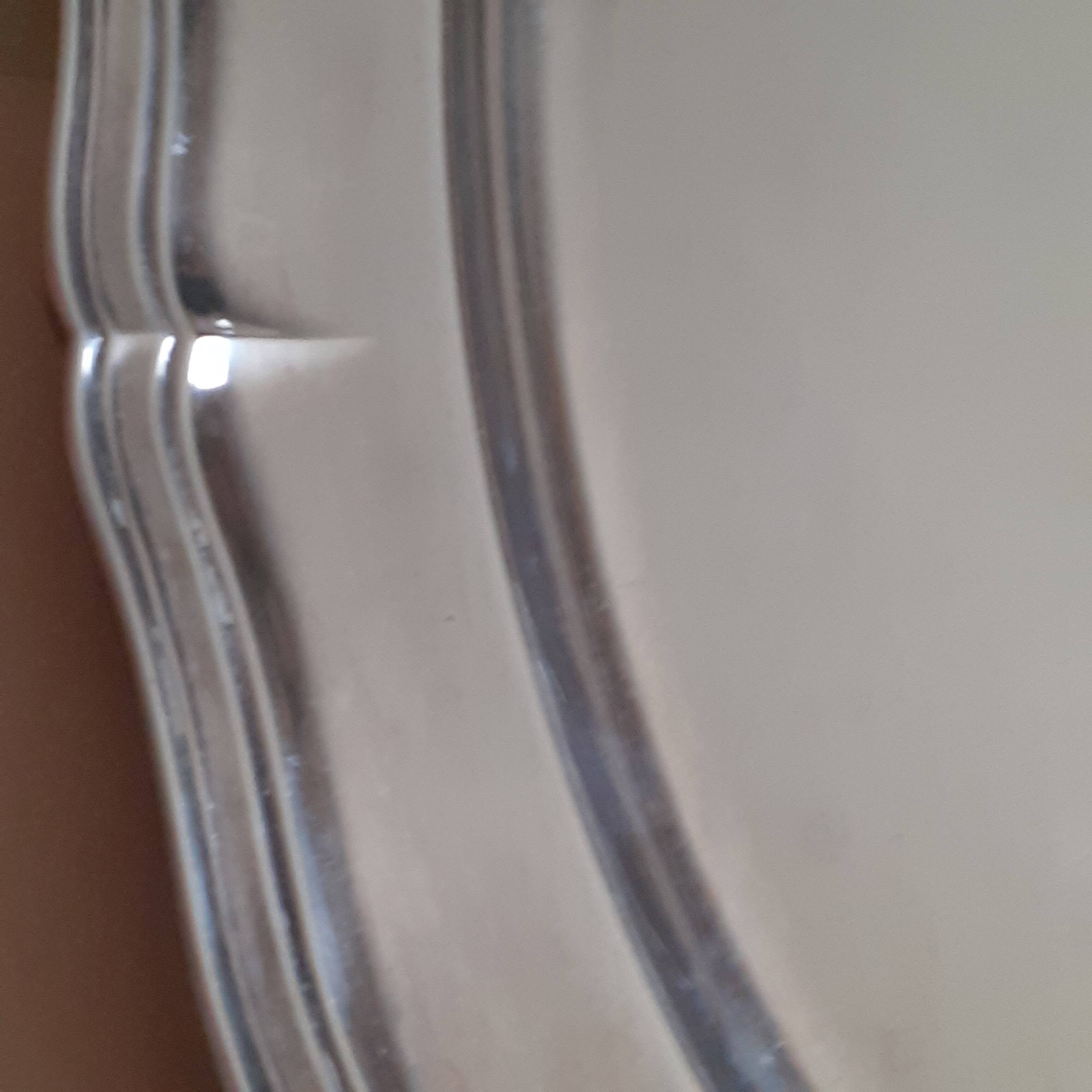 Oval silver metal dish. With initials.