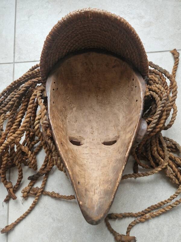 Chokwe Mwana Pwo mask in carved wood with a dark patina and rope hair