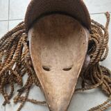 Chokwe Mwana Pwo mask in carved wood with a dark patina and rope hair