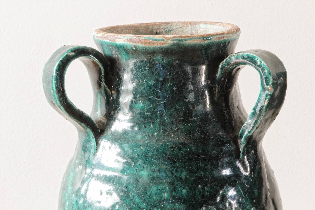 Set of two Chinese green glazed stoneware storage jars.