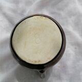 Brown ceramic teapot and milk jugs