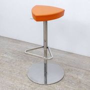 Adjustable orange swivel bar stool