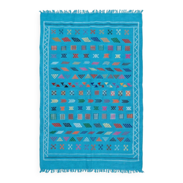 Tapis berbère bleu turquoise motifs multicolores