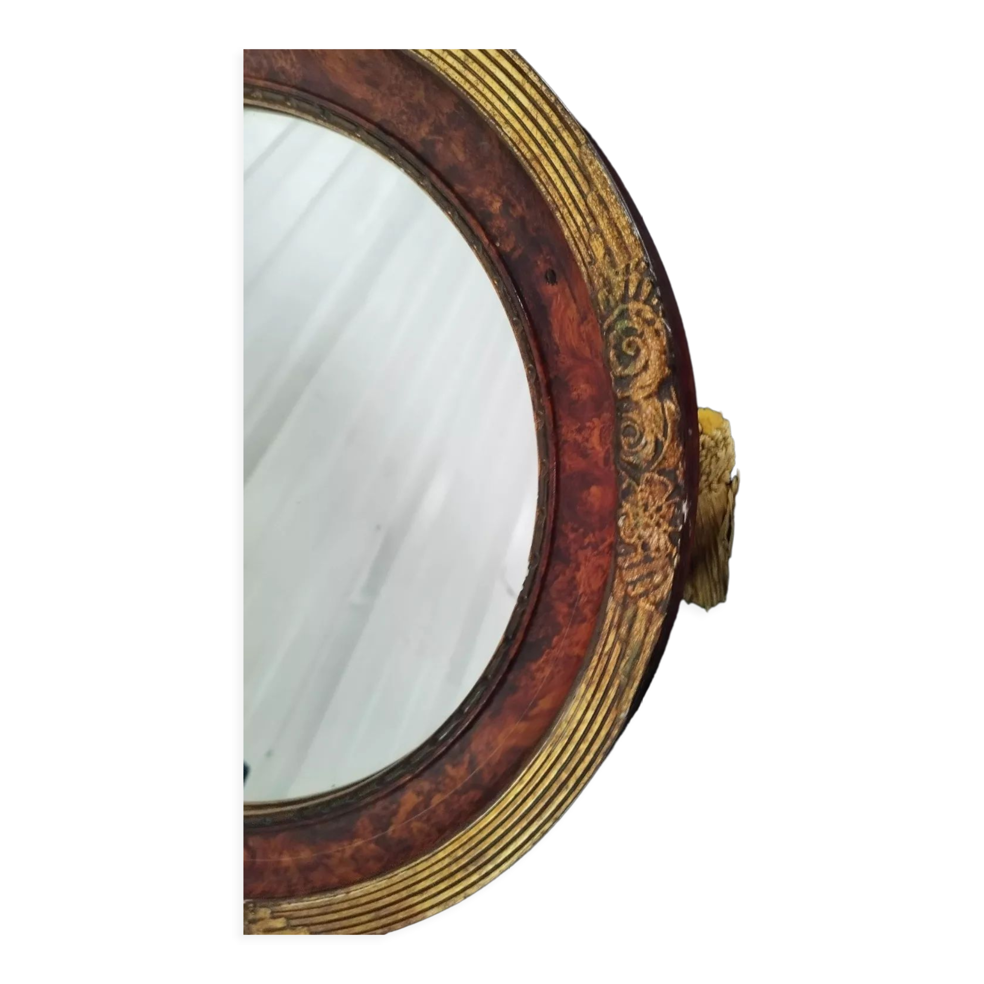 Golden oval art deco mirror