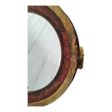 Golden oval art deco mirror