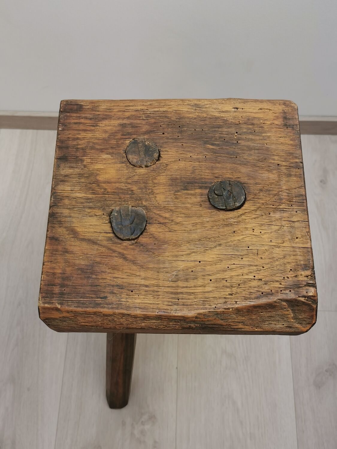 Old wooden stool tripods