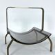 Fontana Arte, Mid-Century brass and curved glass magazine holder. Italy 1960s