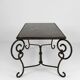 Coffee table in patinated wrought iron and black marble, circa 1940