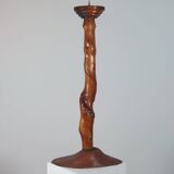 Vintage candle holder in an organic shape with a brass spike and tiered top.