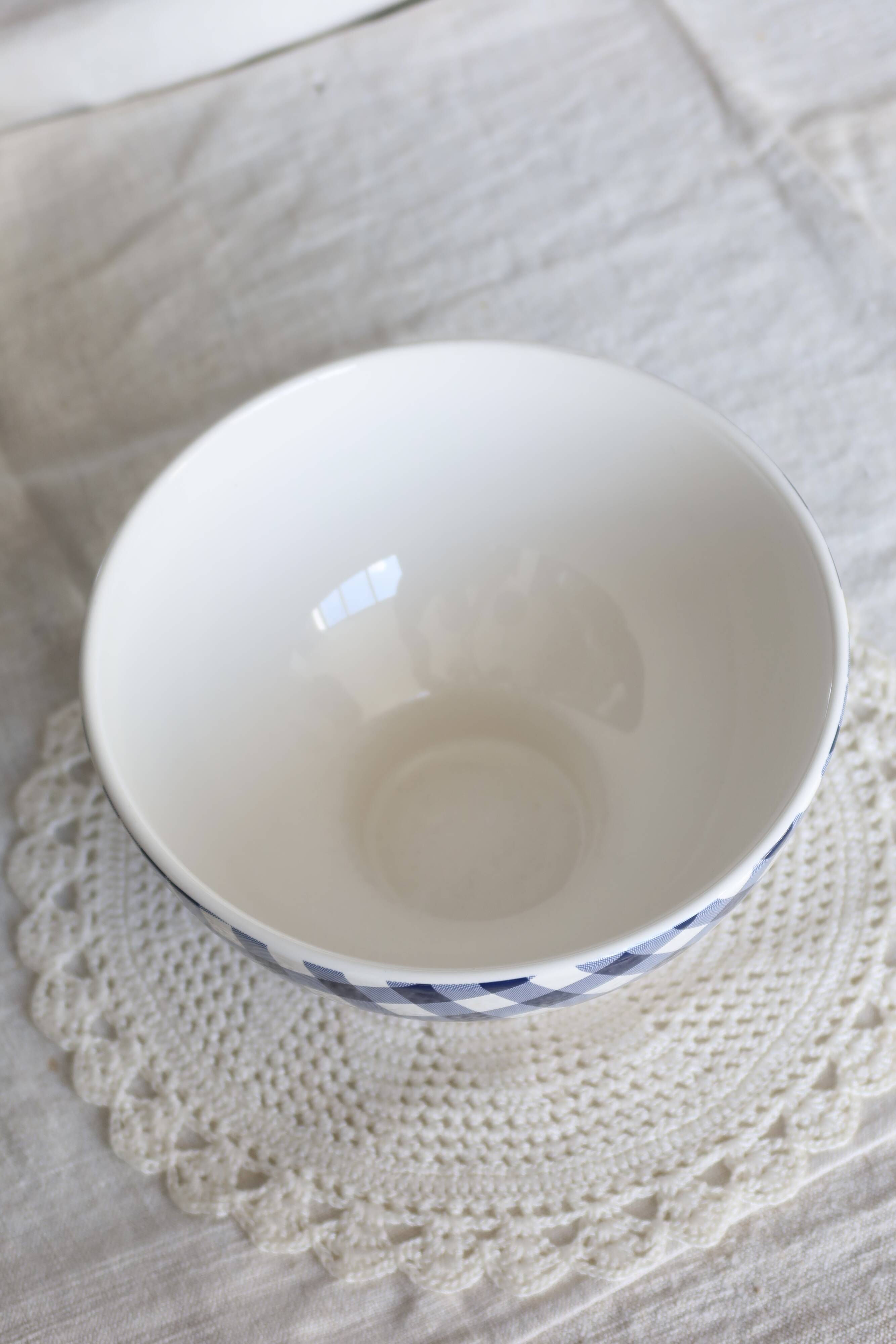 Large vintage white earthenware bowl with blue gingham pattern