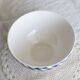 Large vintage white earthenware bowl with blue gingham pattern