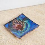 Empty pocket in psychedelic enamelled leather