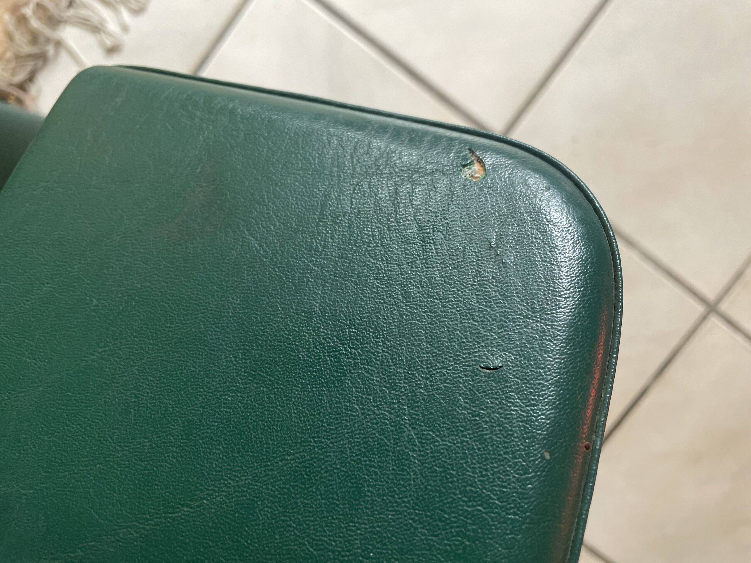 Pair of green faux leather chairs