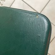 Pair of green faux leather chairs