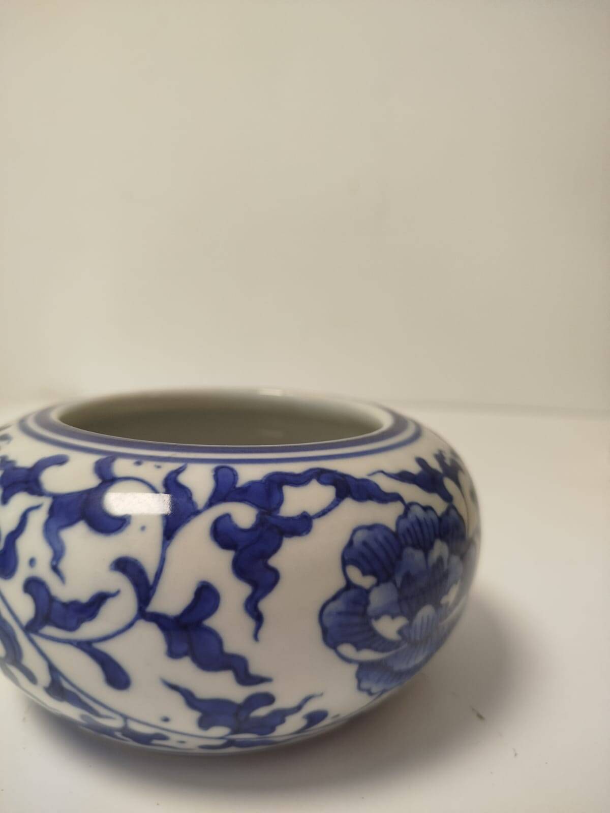 Small round Chinese-style porcelain pot with blue and white decoration