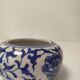 Small round Chinese-style porcelain pot with blue and white decoration