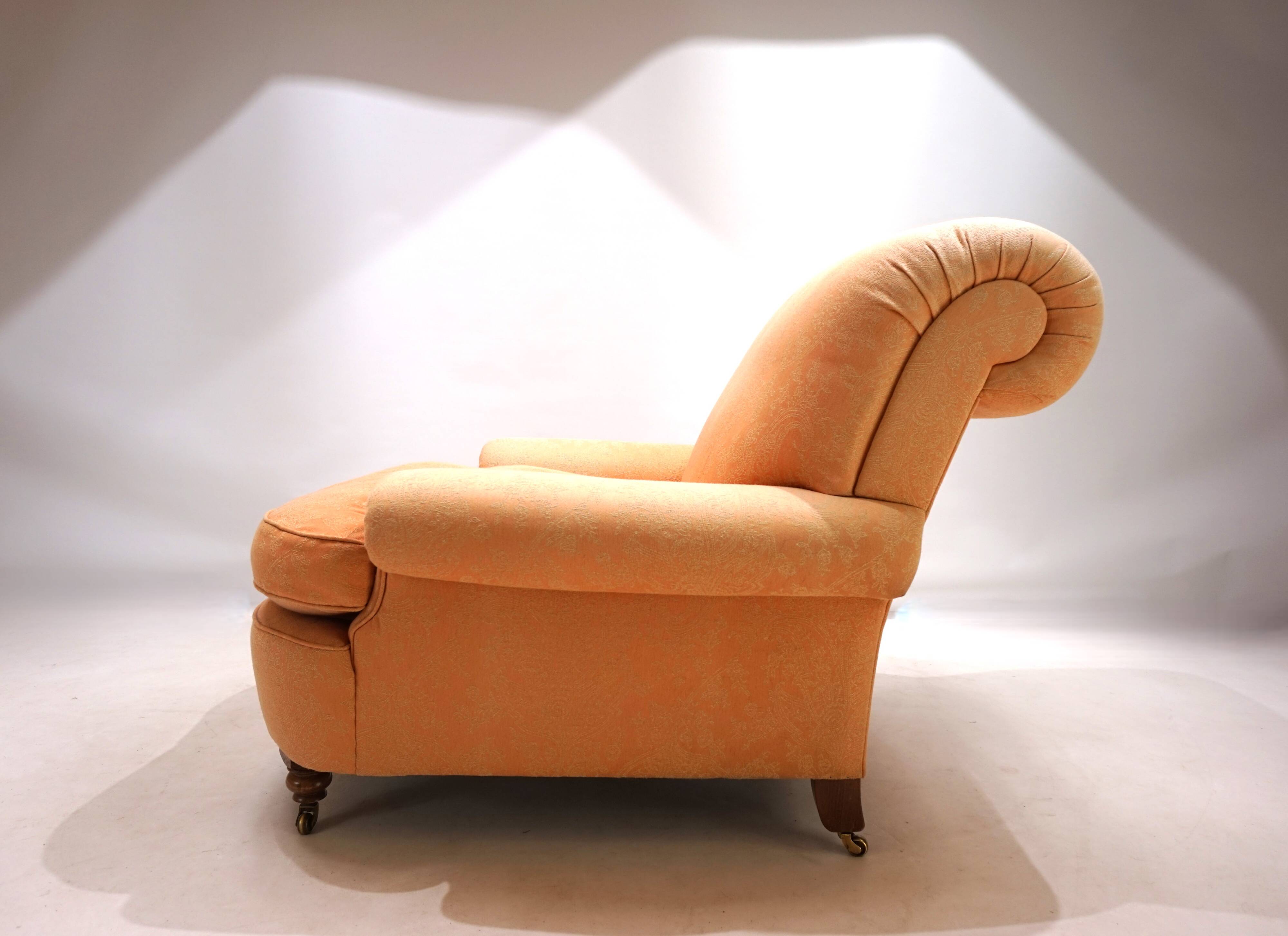 Deep seated armchair in the style of Howard & Sons