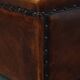 Cognac-colored sheepskin stool with decorative studs