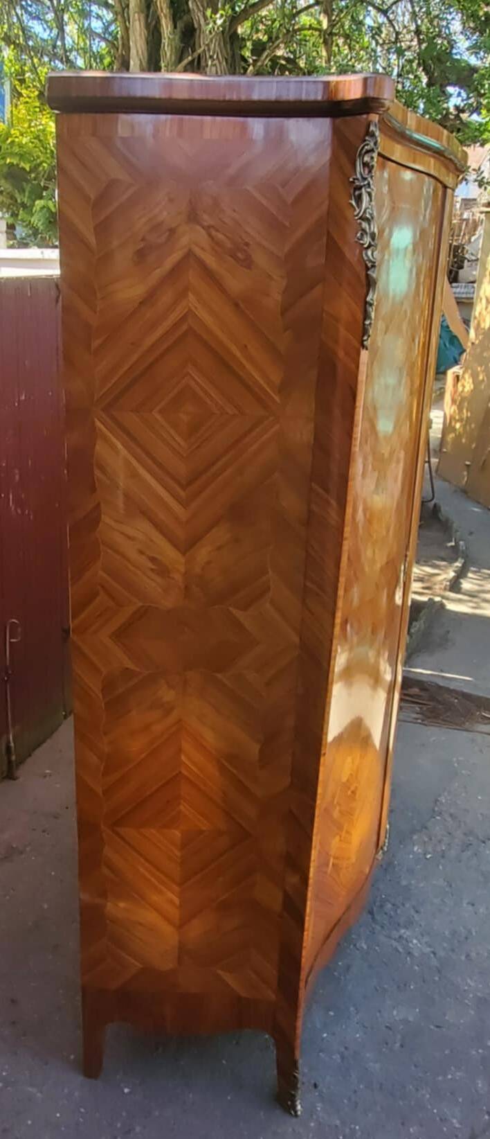 Two-door cabinet with marquetry floral design from the early 20th century.