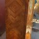 Two-door cabinet with marquetry floral design from the early 20th century.